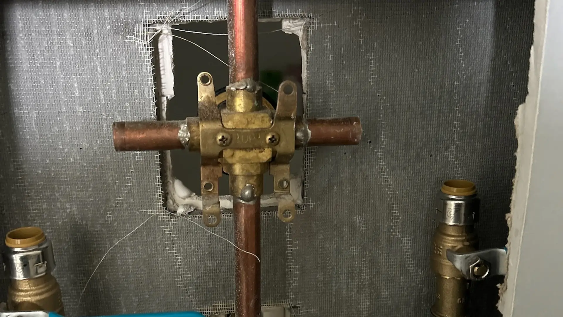 New brass shower valve with copper supply lines and shutoff valves