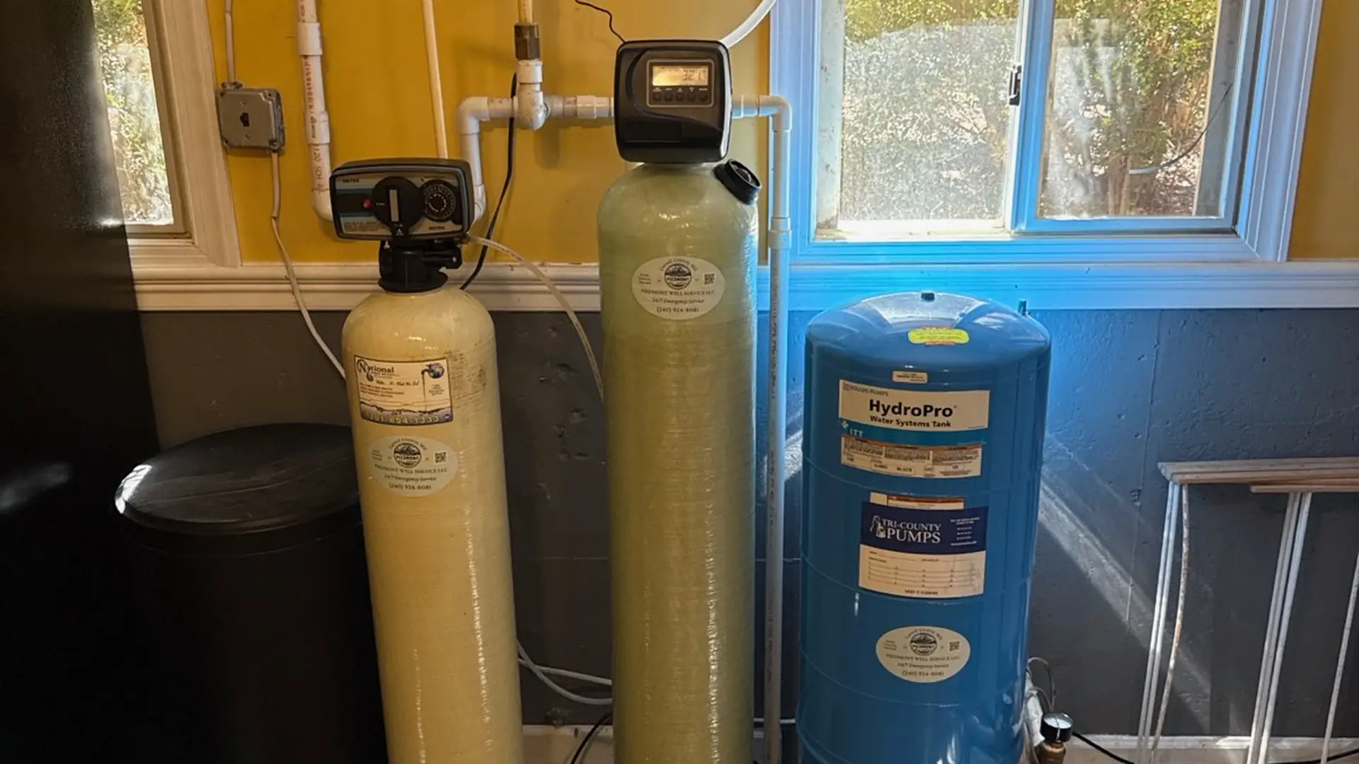Water filtration and softener tanks in a homeowner's utility room