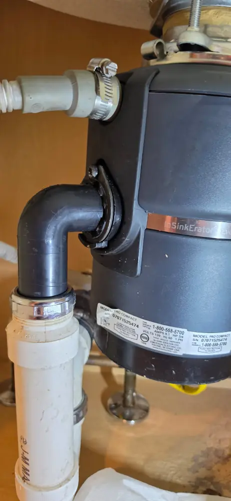 Garbage disposal installed under a kitchen sink