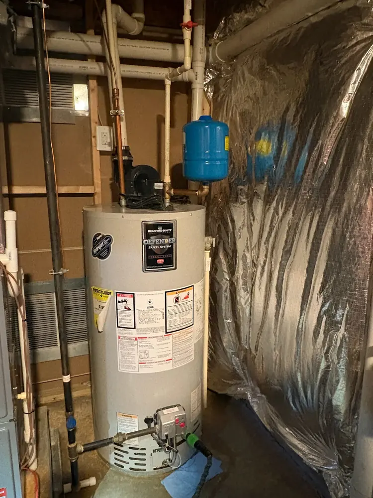 Old power vent water heater before replacement