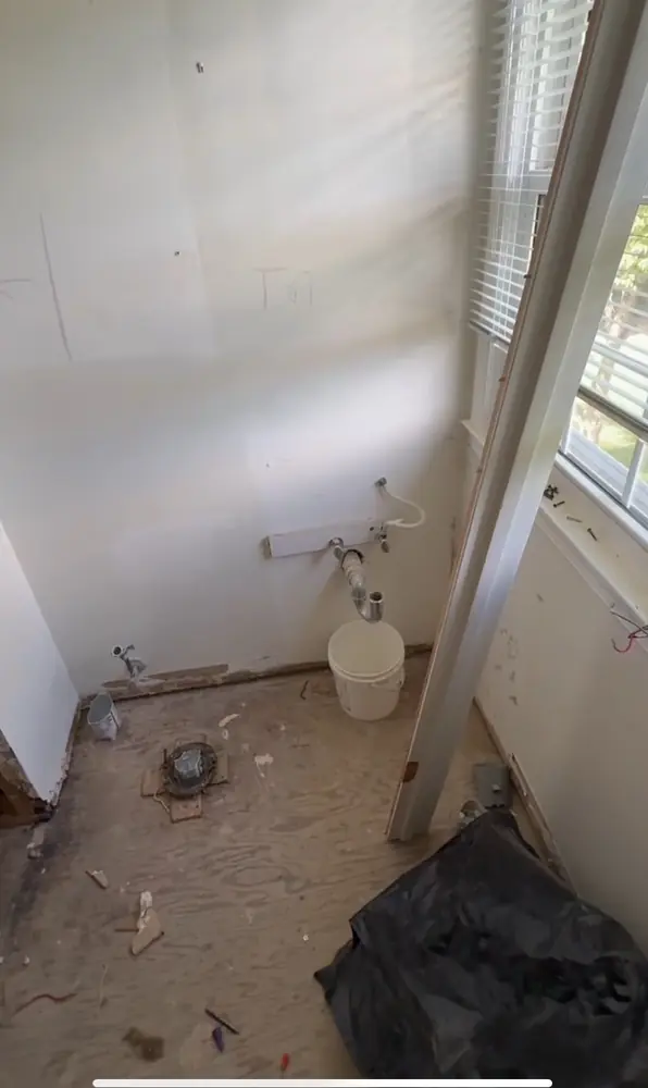 Bathroom with old toilet removed, ready for new toilet install