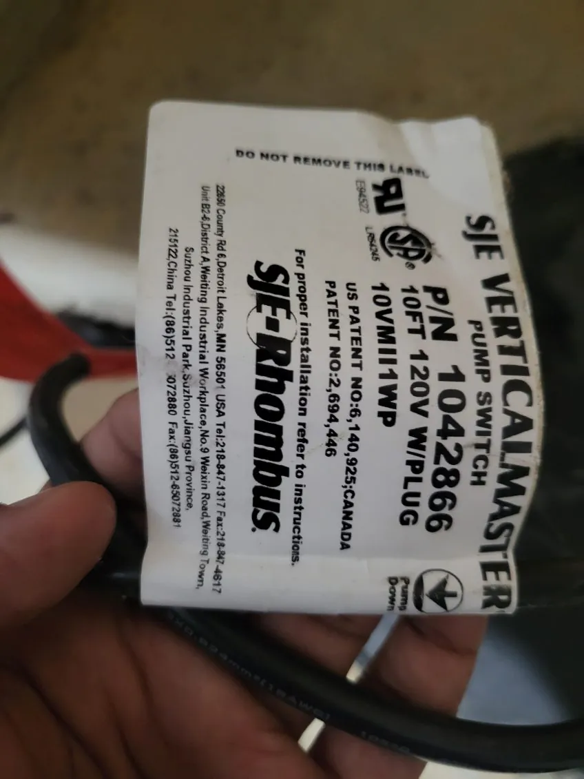 White label on a vertical float switch reading SJE VerticalMaster pump switch, 10 ft cord, 120 V with plug